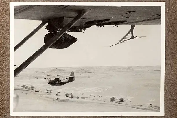 Rare wartime aerial photograph of RAF Catalina flying boats above the River Nile in Egypt while on reconnaissance mission in 1943. Anti-submarine depth charges are connected to the wings.