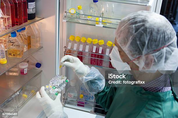 Scientist Takes A Sample From The Refrigerator Stock Photo - Download Image Now - Refrigerator, Laboratory, Healthcare And Medicine