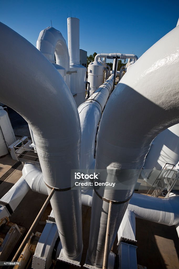 Water Purification Plant Late Day Long Shadows Numerous Transfer Pipes A portion of a water treatment plant in Florida. Building Exterior Stock Photo