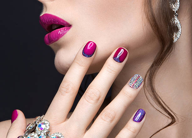 istock girl with a bright evening make-up and pink manicure 471186936