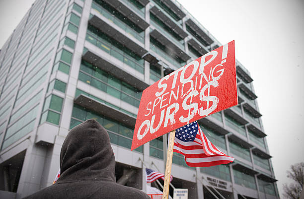 istock Protester Holding Sign outside Building at Utah Tea Party Protest 471187177