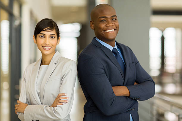 istock corporate colleagues with arms crossed in office 471187670