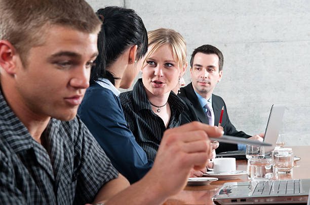 istock business meeting and pointig with pen 471187761