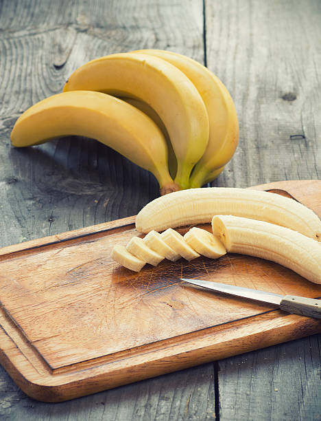 Fresh bananas on wooden background stock photo