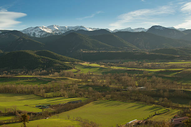 Catalan landscape of the Pyrenees of Spain in the Cerdanya Beautiful landscape of the snowy mountains of the Catalan Pyrenees, in the spring. Image taken from Bellver de Cerdanya (Spain, Girona), from where you can see the snow of the Molina and Masella sky stations of Puigcerdà. llivia stock pictures, royalty-free photos & images