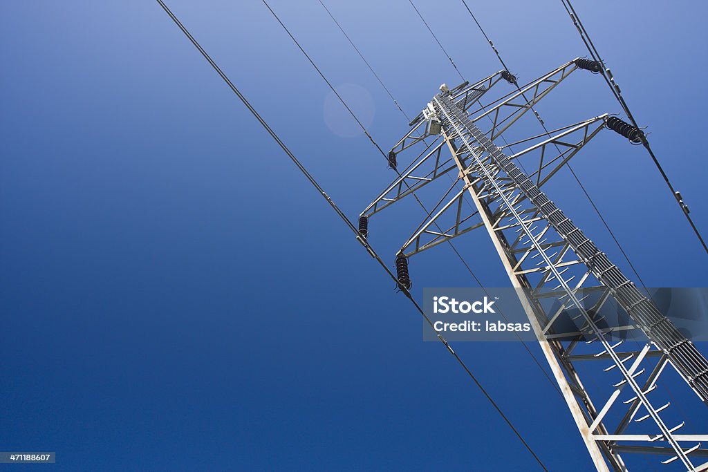 A group view of an electric tower Electricity pylon on a clear blue sky. Power Line Stock Photo