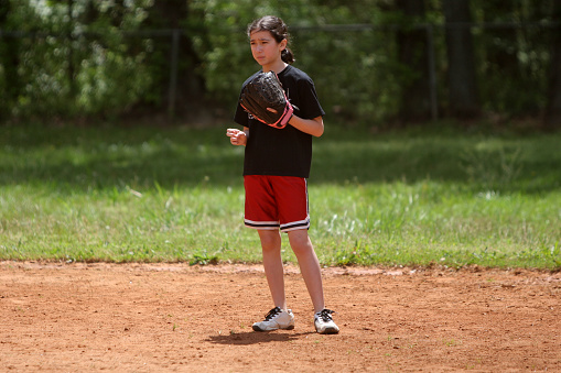 a girl playing softball
