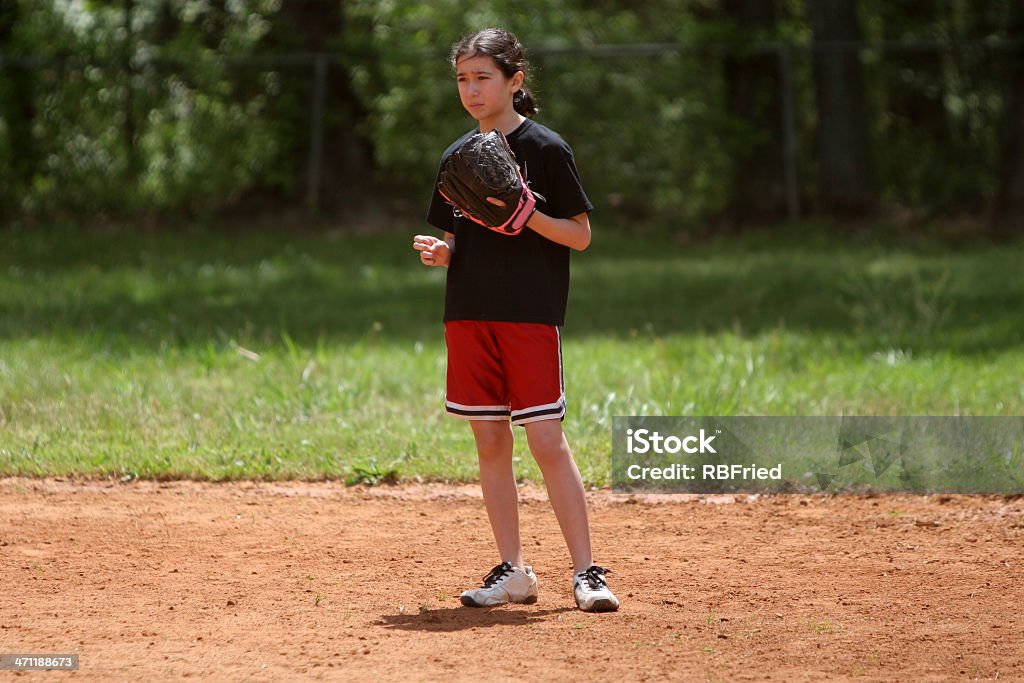 Softball a girl playing softball Teenage Girls Stock Photo