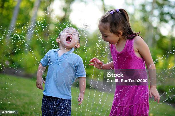 Sprinkler Drinkers Stock Photo - Download Image Now - Child, Sprinkler, Drinking