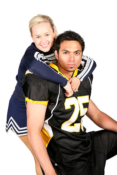 istock Cheerleader Hugging Football Player 471190785