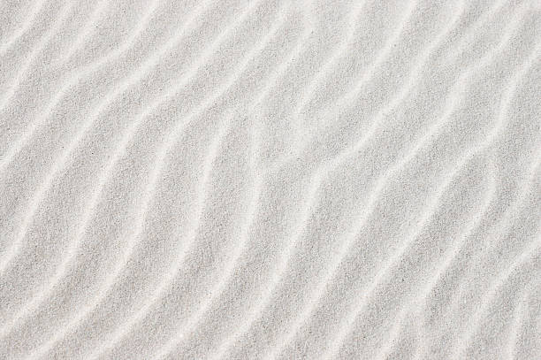 Beach sand White beach sand formed by wind in waves. Also available in vertical crop: sand stock pictures, royalty-free photos & images