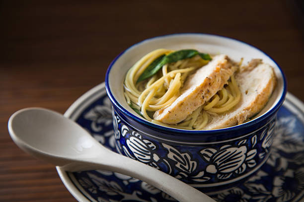 Bowl of Asian chicken noodle soup stock photo