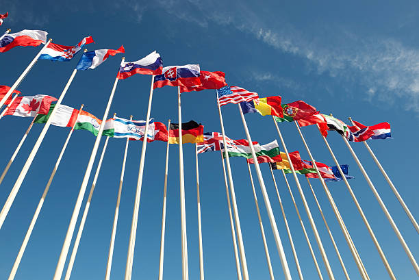 istock flags on flagpoles fluttering in the wind 471191894