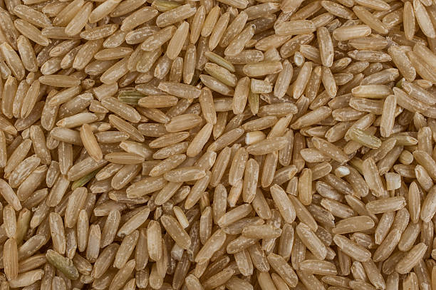 istock Unpolished brown rice texture background 471192268