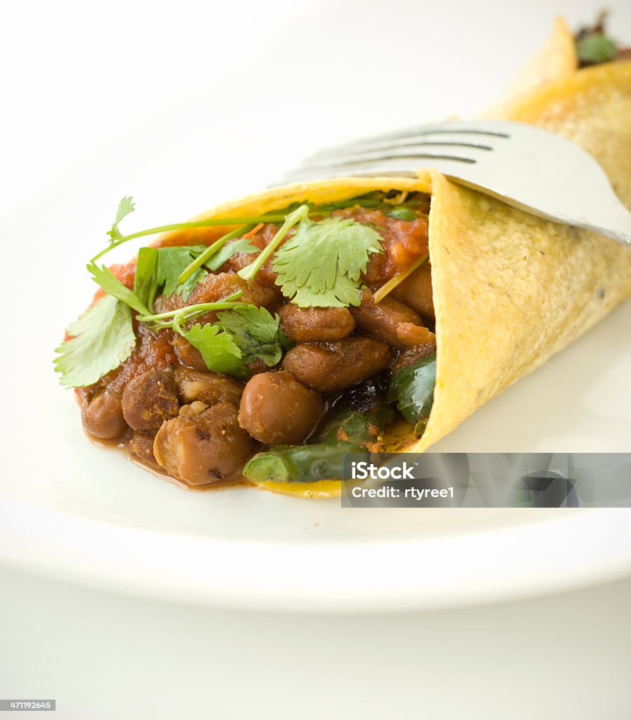 Vegetarian Bean Burrito Spicy red beans,grilled peppers,onions,salsa, and cilantro inside a corn tortilla Bell Pepper Stock Photo