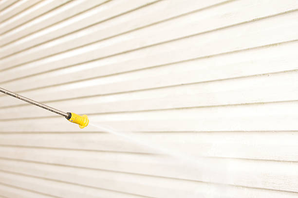 istock pressure washing house side 471193273