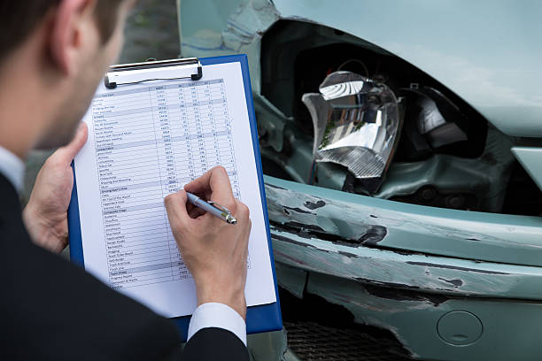 istock Insurance Agent Examining Car After Accident 471193760