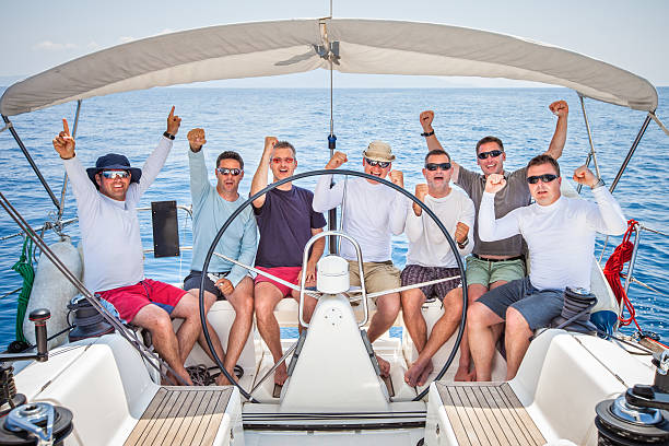 istock Happy sailing crew on sailboat 471194004