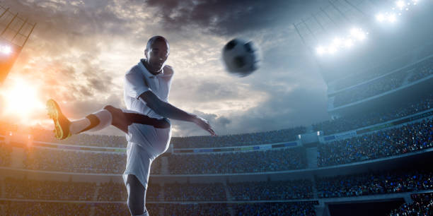 サッカー選手ボールを蹴るスタジアム - soccer player men flying kicking ストックフォトと画像