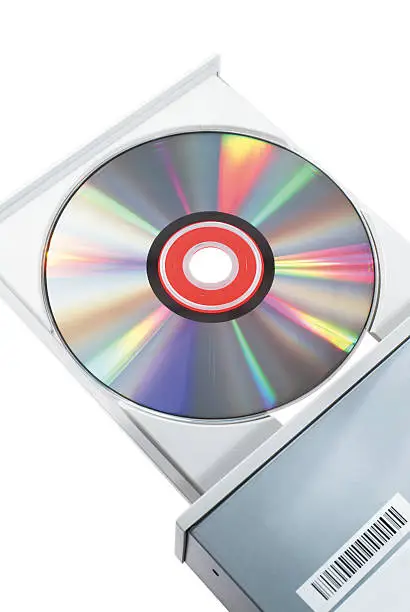 A computer DVD shown in the open tray of the dvd burner/reader.