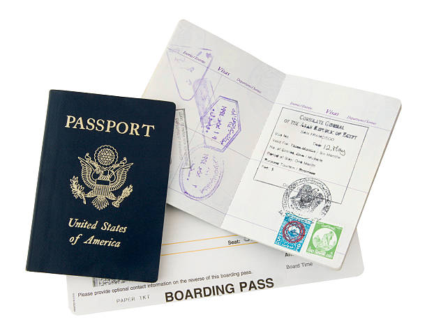 Passport and boarding pass for a trip stock photo
