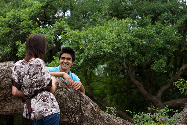 young couple in the park stock photo