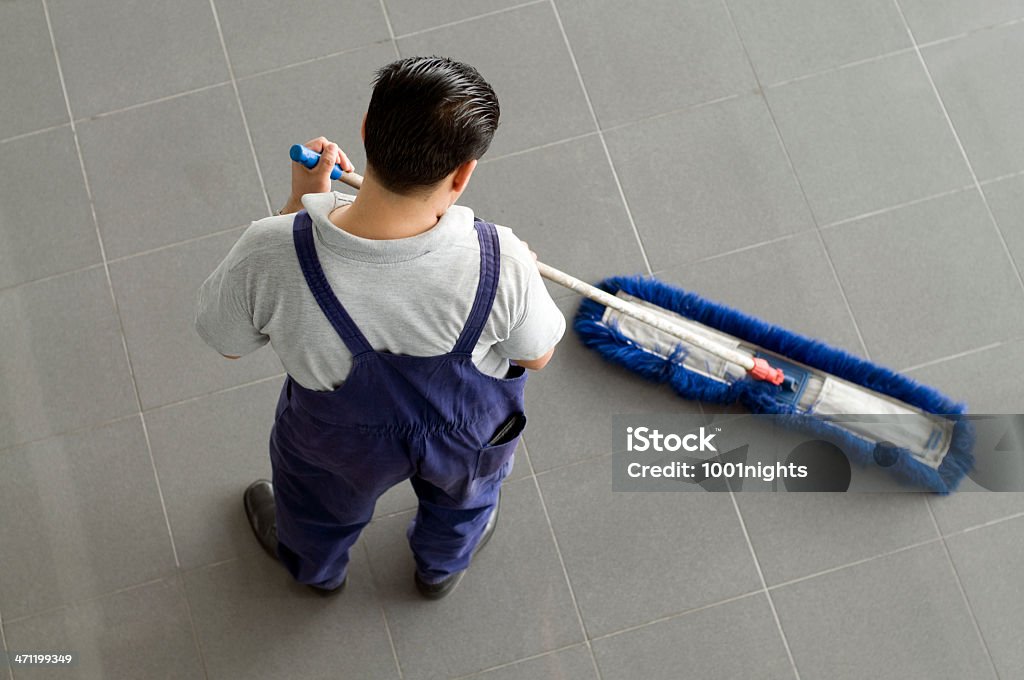 Man cleaning the floor Activity Stock Photo