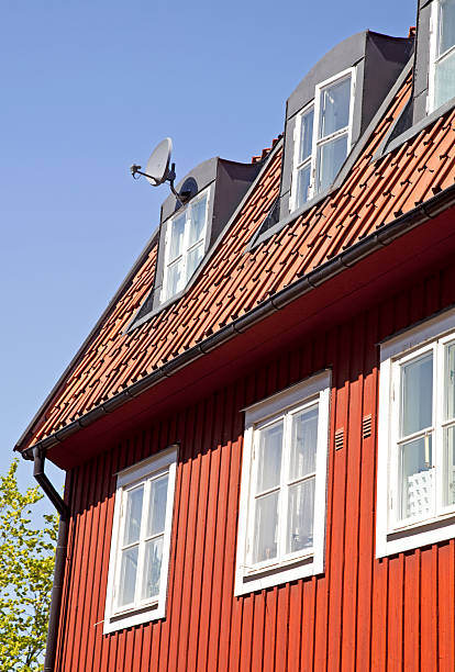 istock Old red house with satellite dish 471199527