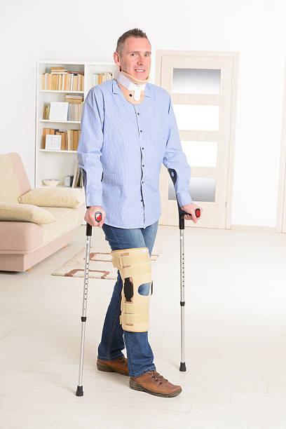 istock Man with leg in knee cages 471199884