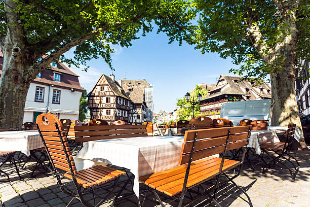 Petite France in Strasbourg Restaurant in Petite France / Strasbourg petite france strasbourg stock pictures, royalty-free photos & images