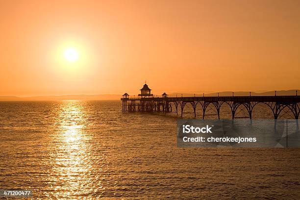 Pier Silhouette Sunset Stock Photo - Download Image Now - Back Lit, Beach, Beauty