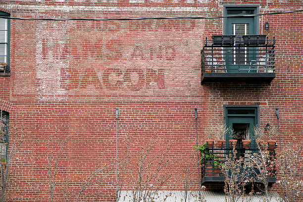 Faded Sign on Brick Wall stock photo