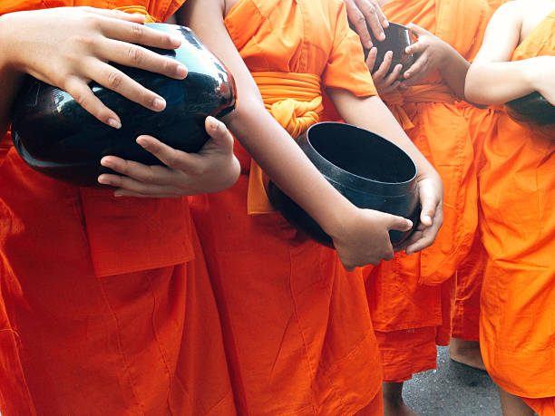 istock food offering to a monk 471201788