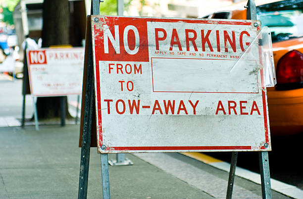 istock No parking sign on urban street 471202365