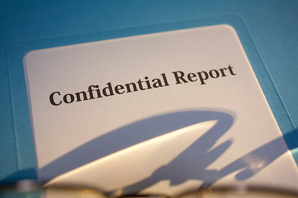 istock Confidential Report with Warm Light and Shadows Close-up 471203283