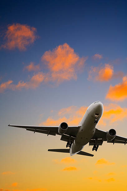 istock Commercial plane landing at dusk 471203861