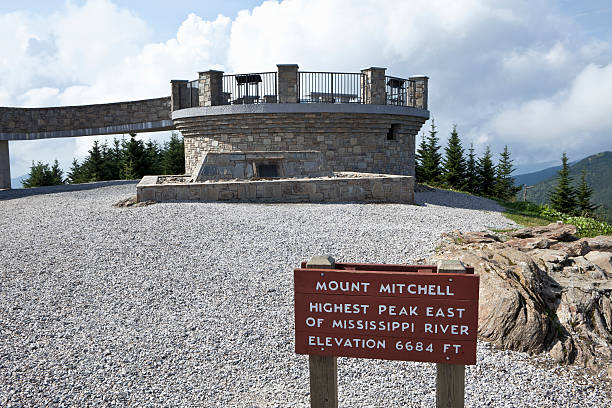 Mount Mitchell Summit the Higest Peak in Eastern USA Observation deck on the summit of Mount Mitchell, the highest peak east of the Mississippi River in the U.S.A. Elevation at point of photo is 6,684 feet above sea level. Mt. Mitchell, which is part of the Black Mountain Range of the Appalachian Mountains, is a North Carolina State Park which borders the Blue Ridge Parkway National Park.  mt mitchell stock pictures, royalty-free photos & images