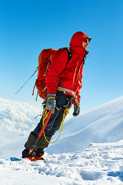 istock hiker at the top of a pass 471205770