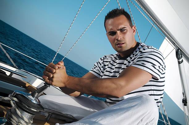 istock Attractive male on the sailboat 471206275