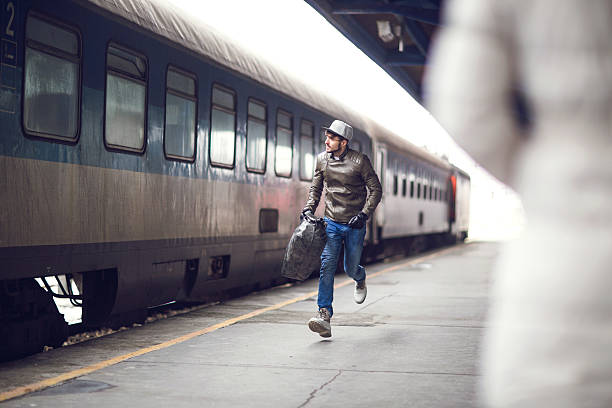 istock Young man running to catch the train. 471206426