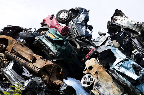 Crushed cars stacked up for recycling