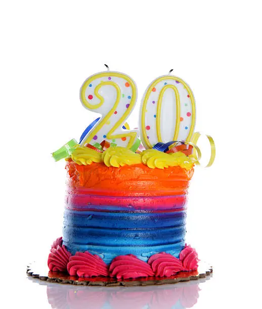 A colorful birthday cake on a white background with an "20" candle