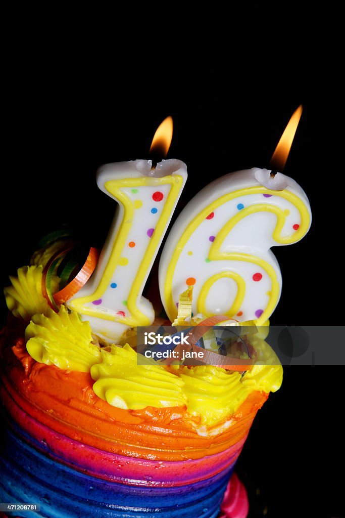 16th Birthday Cake A colorful birthday cake on a white background with an "16" candle 16th Birthday Stock Photo