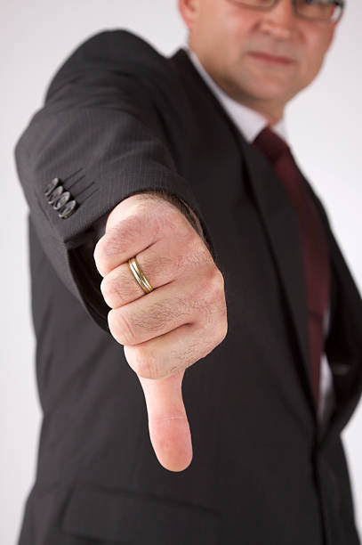 istock Business man showing thumbs down 471210217