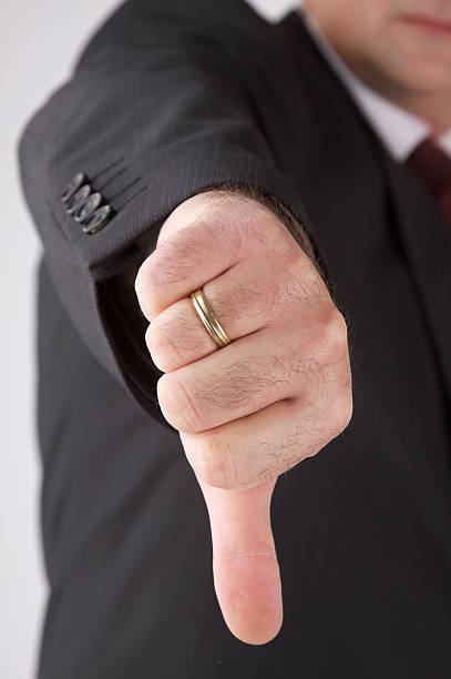 istock Business man showing thumbs down 471210219