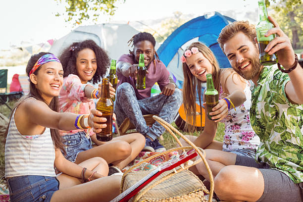 istock Hipsters having fun in their campsite 471211030