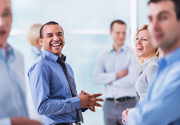istock Group of cheerful business people laughing. 471211110