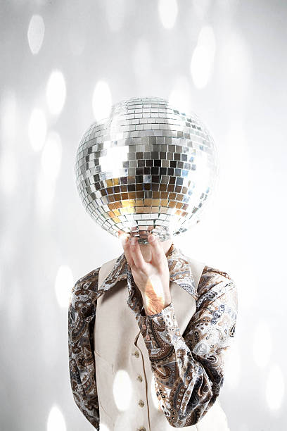 istock Filtered image of a man holding a disco ball 471212184