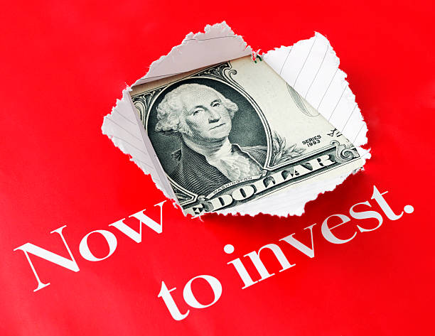istock Paper torn with window opening to show dollar bill 471214191