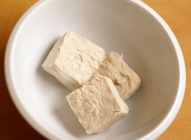 Baker&#180;s yeast Yeast in white bowl. bakers yeast stock pictures, royalty-free photos & images